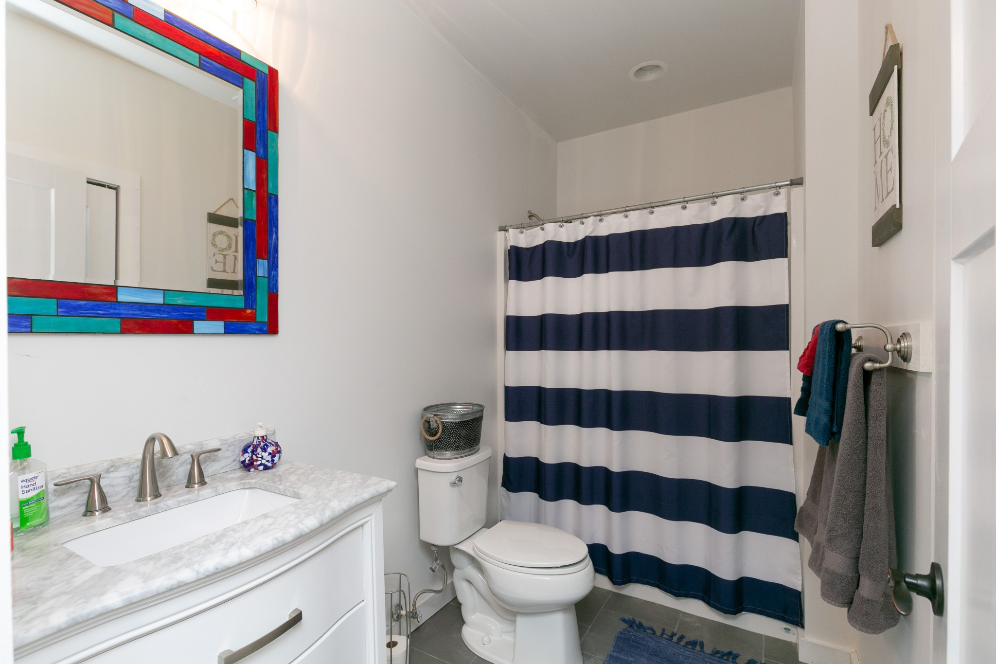 4920 Galen Road Lafayette, TN 37083 - Photo 27 of 47 a bathroom with a sink a toilet and a mirror