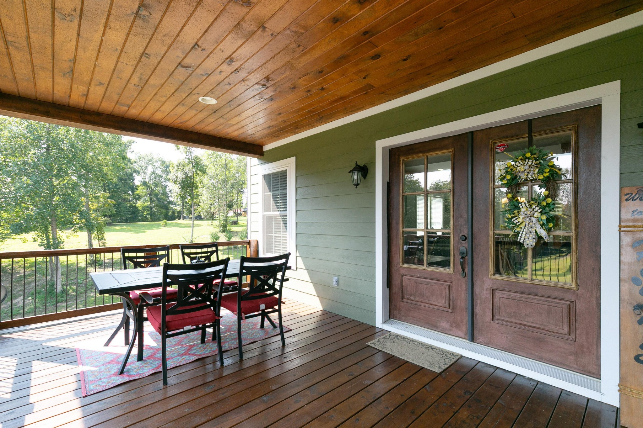 4920 Galen Road Lafayette, TN 37083 - Photo 29 of 47 a view of a patio with table and chairs and wooden floor