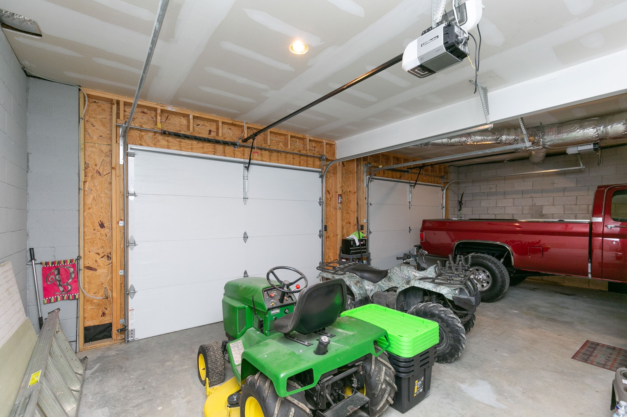 4920 Galen Road Lafayette, TN 37083 - Photo 32 of 47 a car and bike parked in a garage