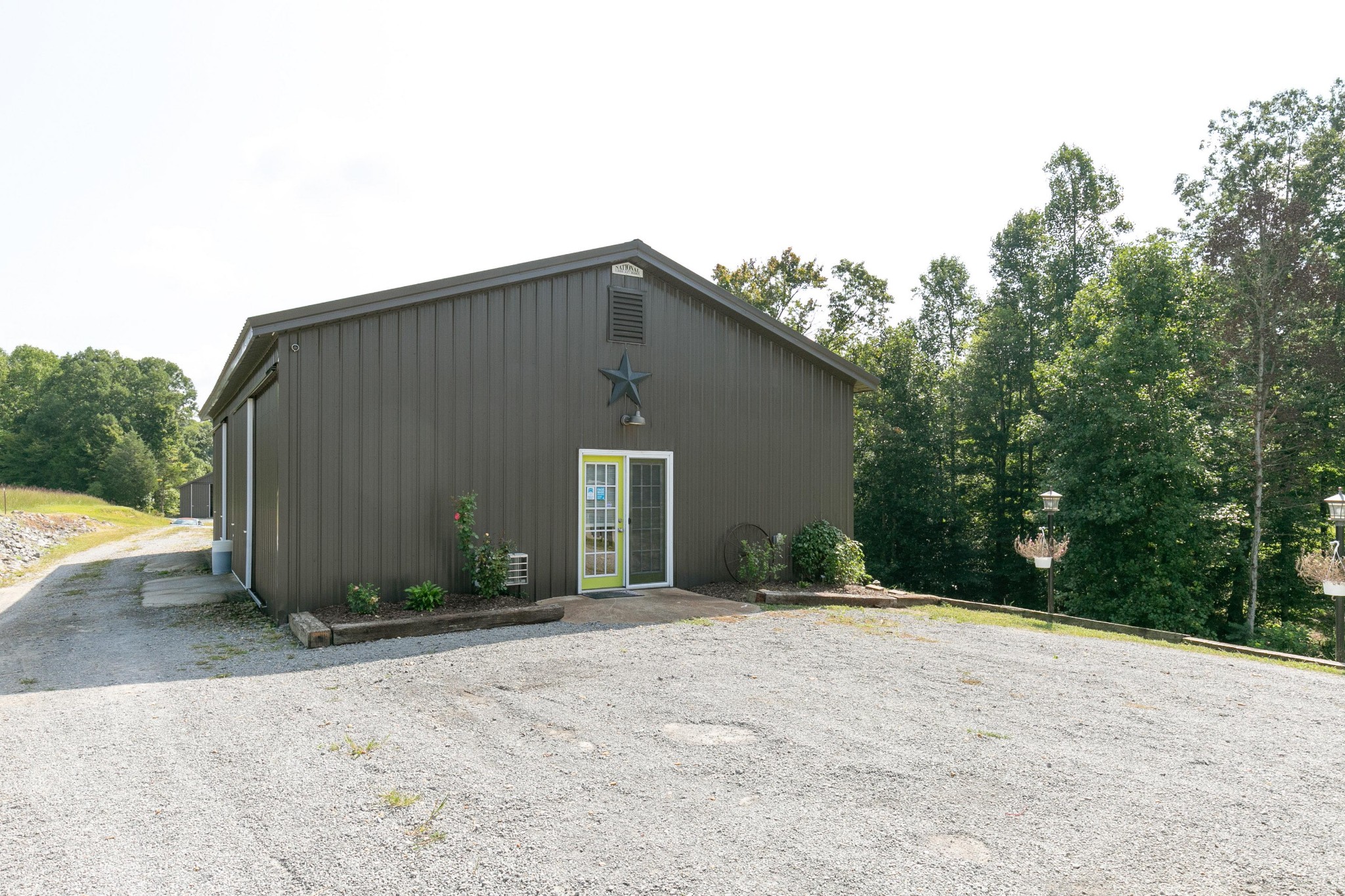 4920 Galen Road Lafayette, TN 37083 - Photo 34 of 47 a view of a house with backyard and bushes