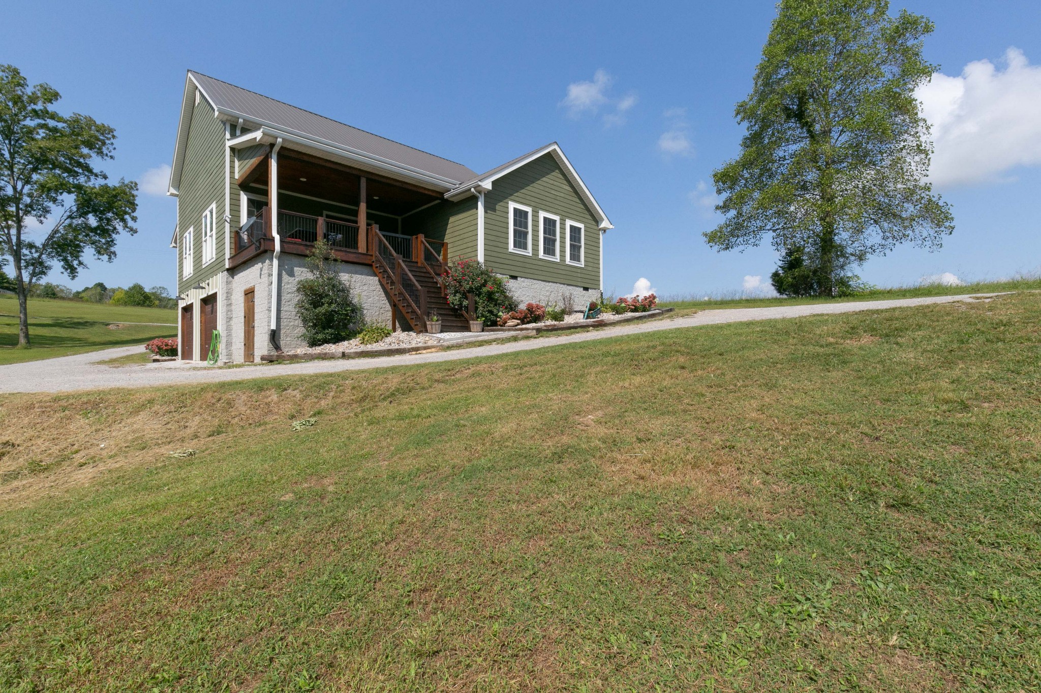 4920 Galen Road Lafayette, TN 37083 - Photo 44 of 47 a front view of a house with yard and green space