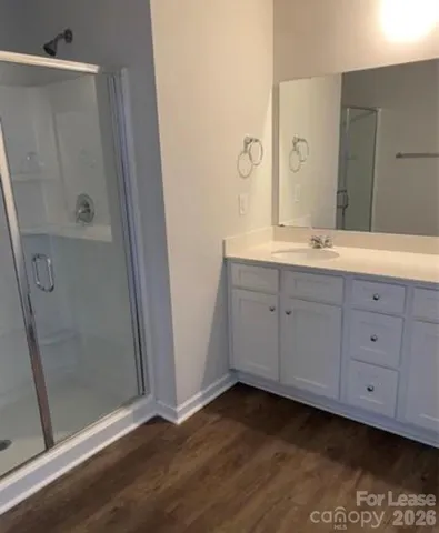 a bathroom with a double vanity sink and mirror