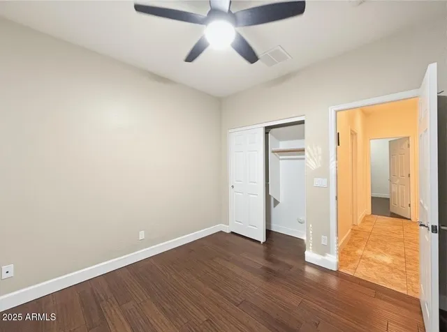 a bathroom with a tub a sink and mirror