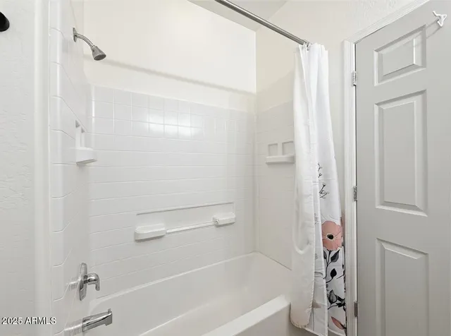 a view of a hallway with wooden shelves