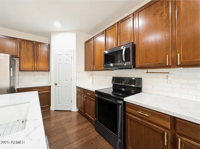 a room with a bed and wooden floor