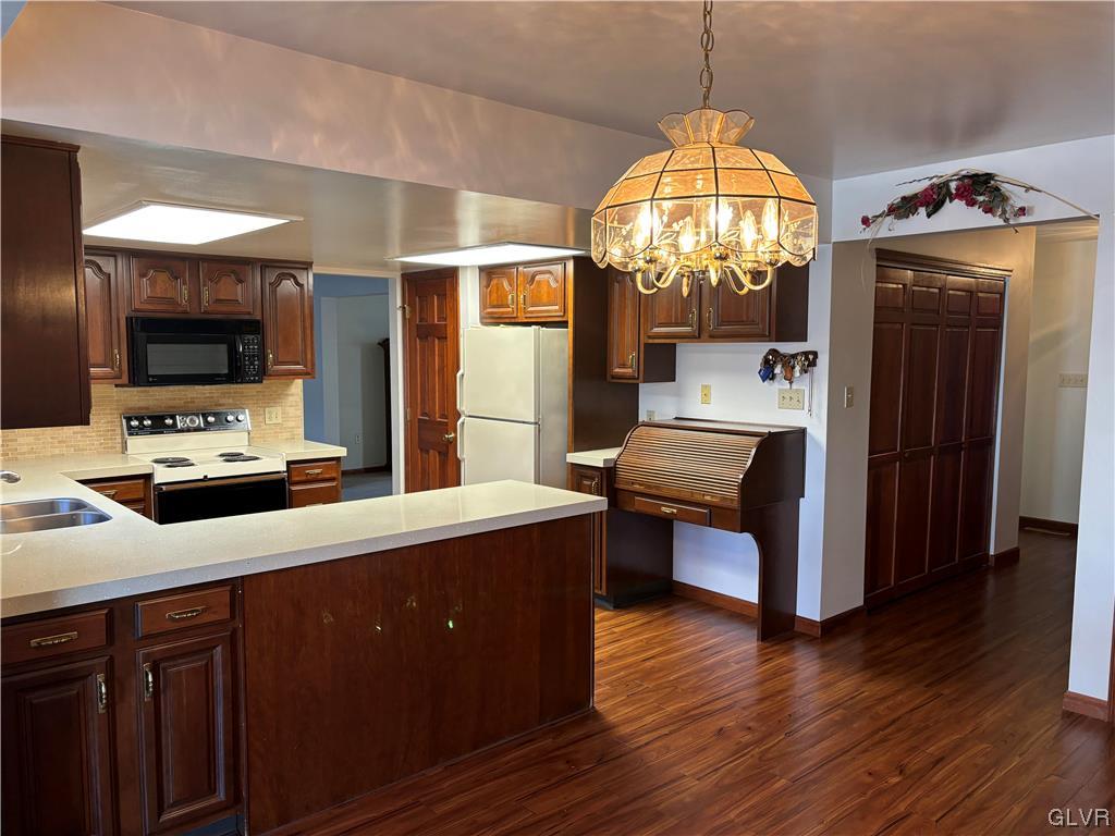 520 West Moorestown Road Nazareth, PA 18064 - Photo 15 of 46 a kitchen with stainless steel appliances granite countertop a sink stove and wooden floor