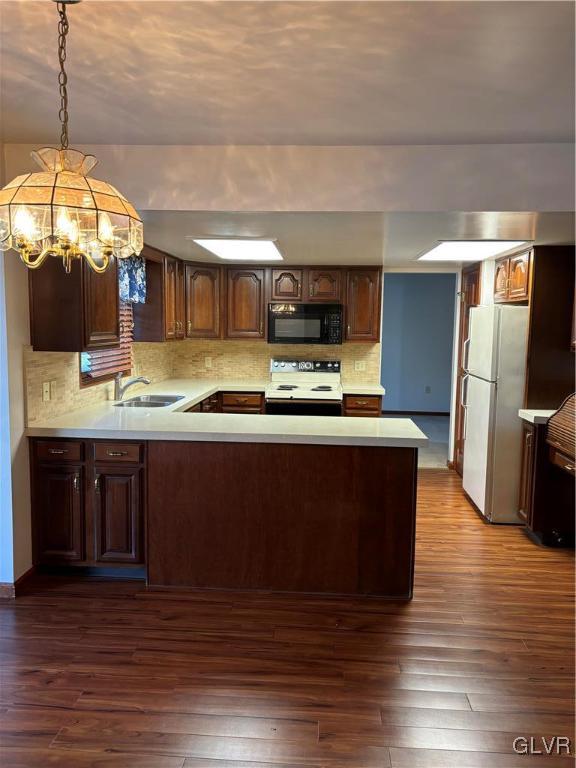 520 West Moorestown Road Nazareth, PA 18064 - Photo 17 of 46 a kitchen with kitchen island granite countertop a stove a sink a refrigerator and a wooden floor
