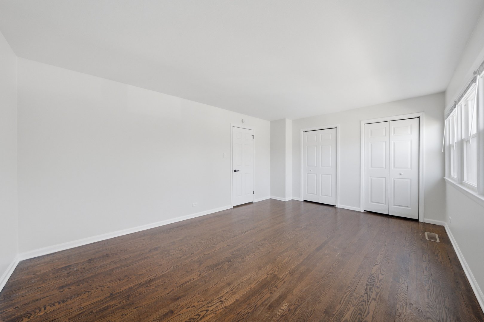 74 West 140th Street Riverdale, IL 60827 - Photo 16 of 37 a view of an empty room with wooden floor