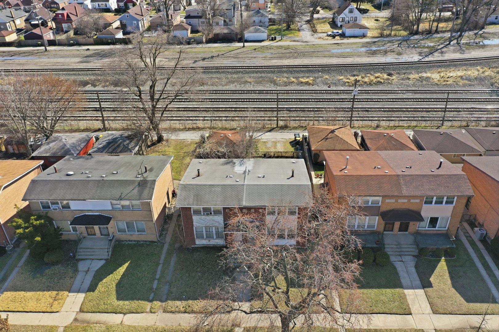 74 West 140th Street Riverdale, IL 60827 - Photo 33 of 37 an aerial view of a house with a yard