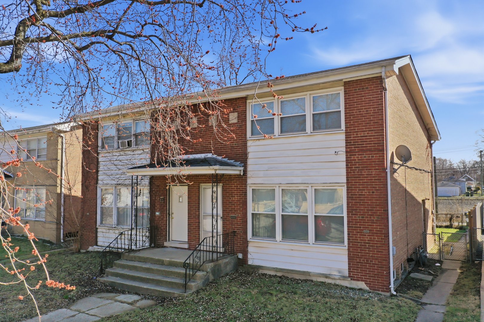 74 West 140th Street Riverdale, IL 60827 - Photo 34 of 37 a front view of a house with a porch