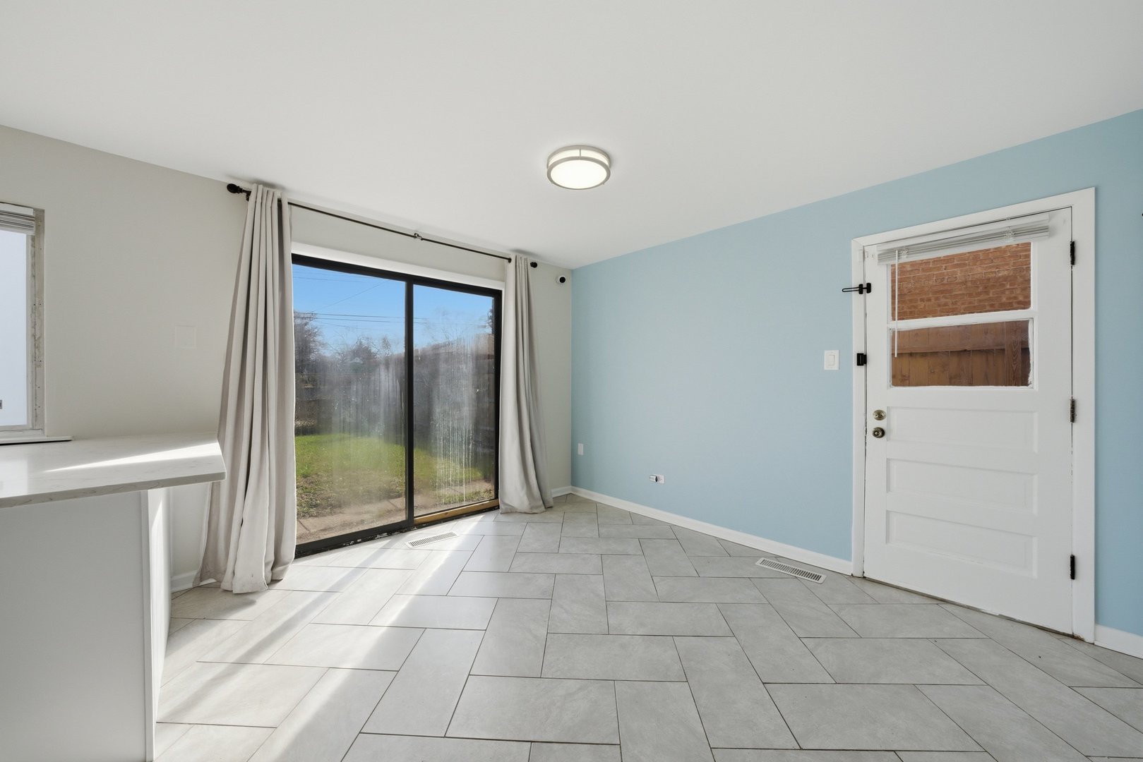 74 West 140th Street Riverdale, IL 60827 - Photo 6 of 37 a view of an empty room and window