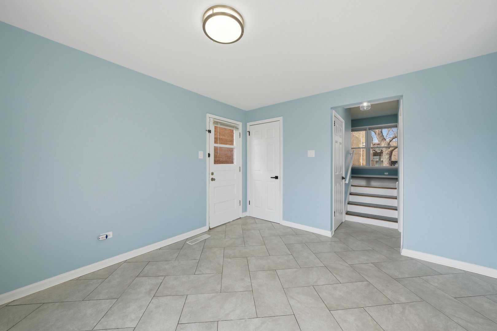 74 West 140th Street Riverdale, IL 60827 - Photo 7 of 37 an empty room with windows