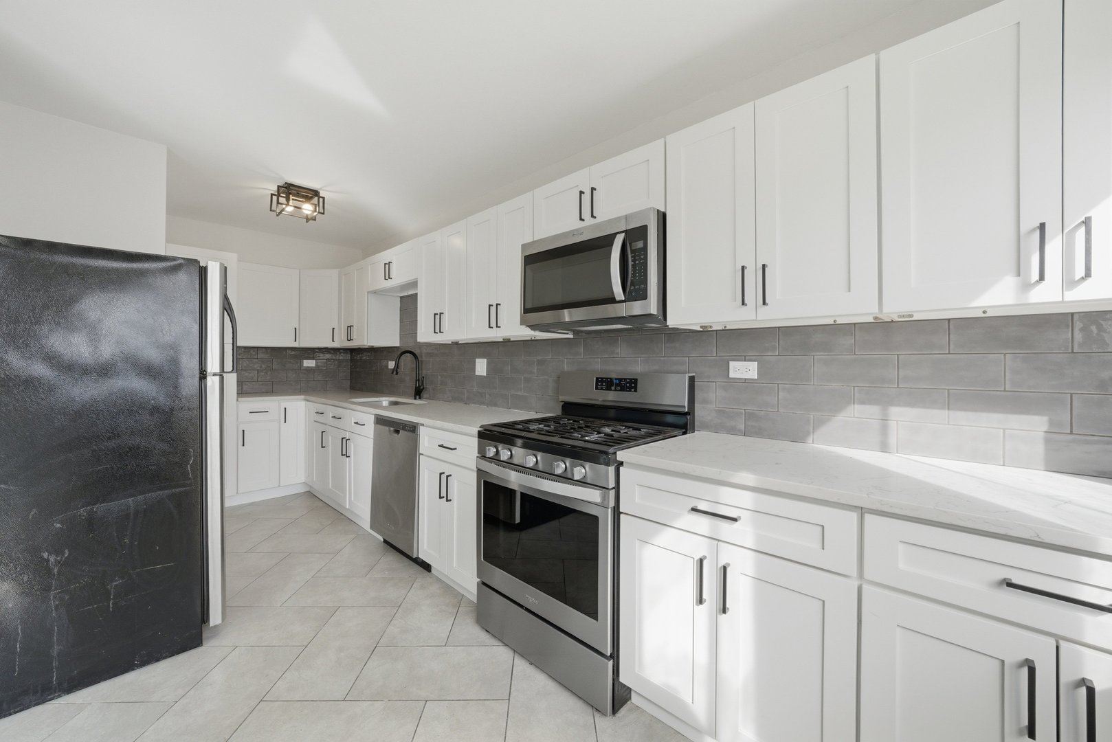 74 West 140th Street Riverdale, IL 60827 - Photo 10 of 37 a kitchen with cabinets stainless steel appliances and sink