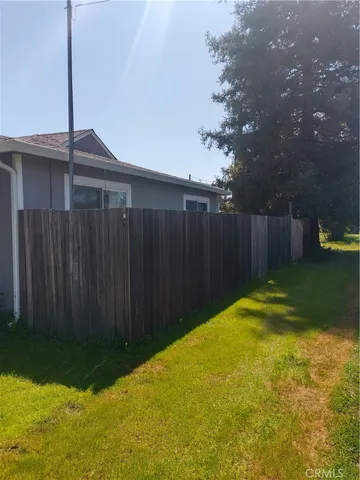 a view of a backyard with potted plants