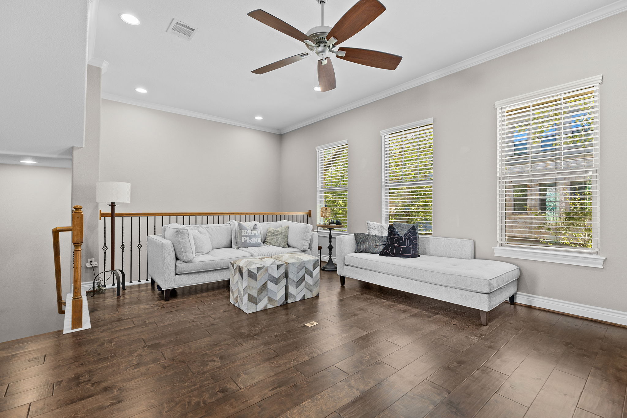 1125 Highknoll Lane Georgetown, TX 78628 - Photo 15 of 40 Living room with ornamental molding, dark wood finished floors, ceiling fan, and recessed lighting