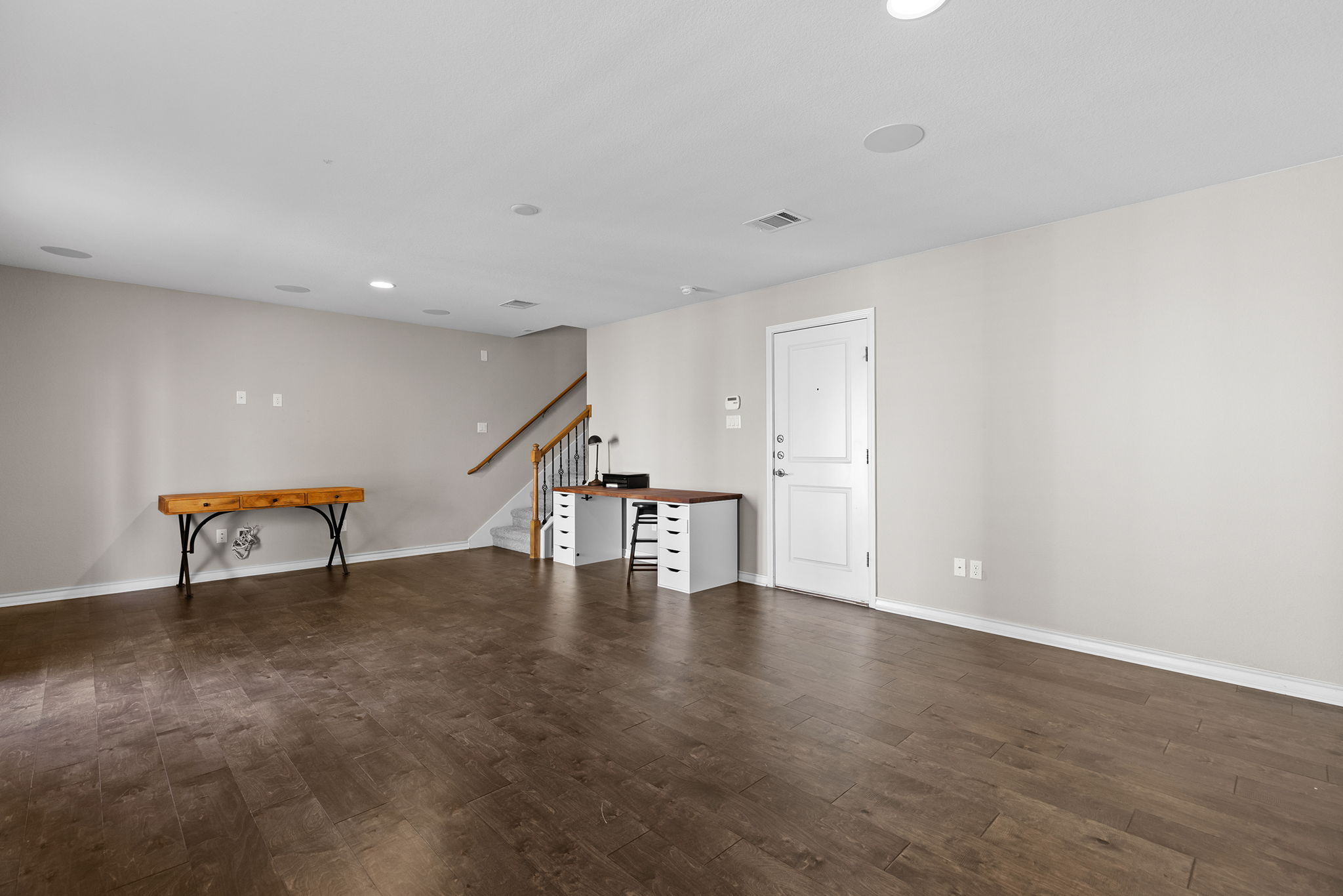 1125 Highknoll Lane Georgetown, TX 78628 - Photo 17 of 40 Unfurnished living room featuring dark wood-style floors and recessed lighting