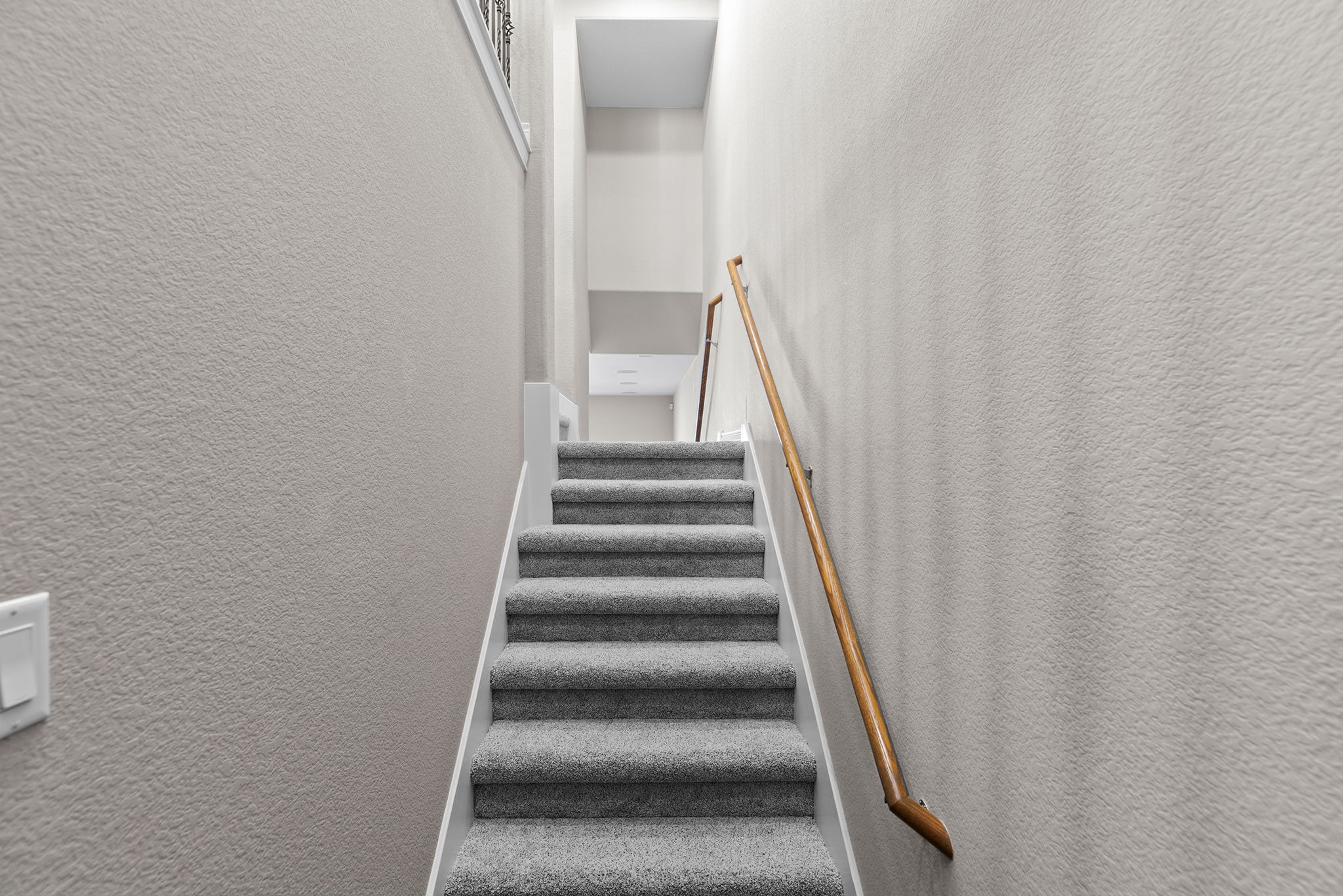 1125 Highknoll Lane Georgetown, TX 78628 - Photo 19 of 40 Staircase with a textured wall