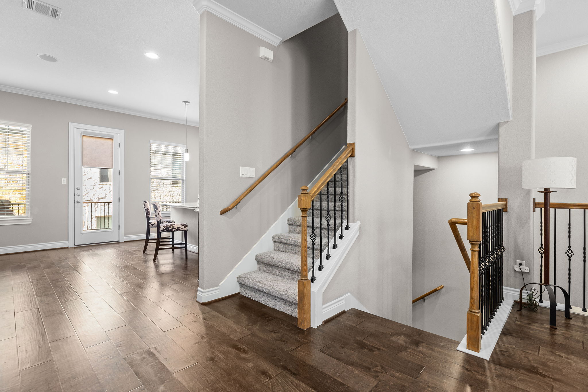 1125 Highknoll Lane Georgetown, TX 78628 - Photo 21 of 40 Staircase with crown molding, wood-type flooring, and recessed lighting