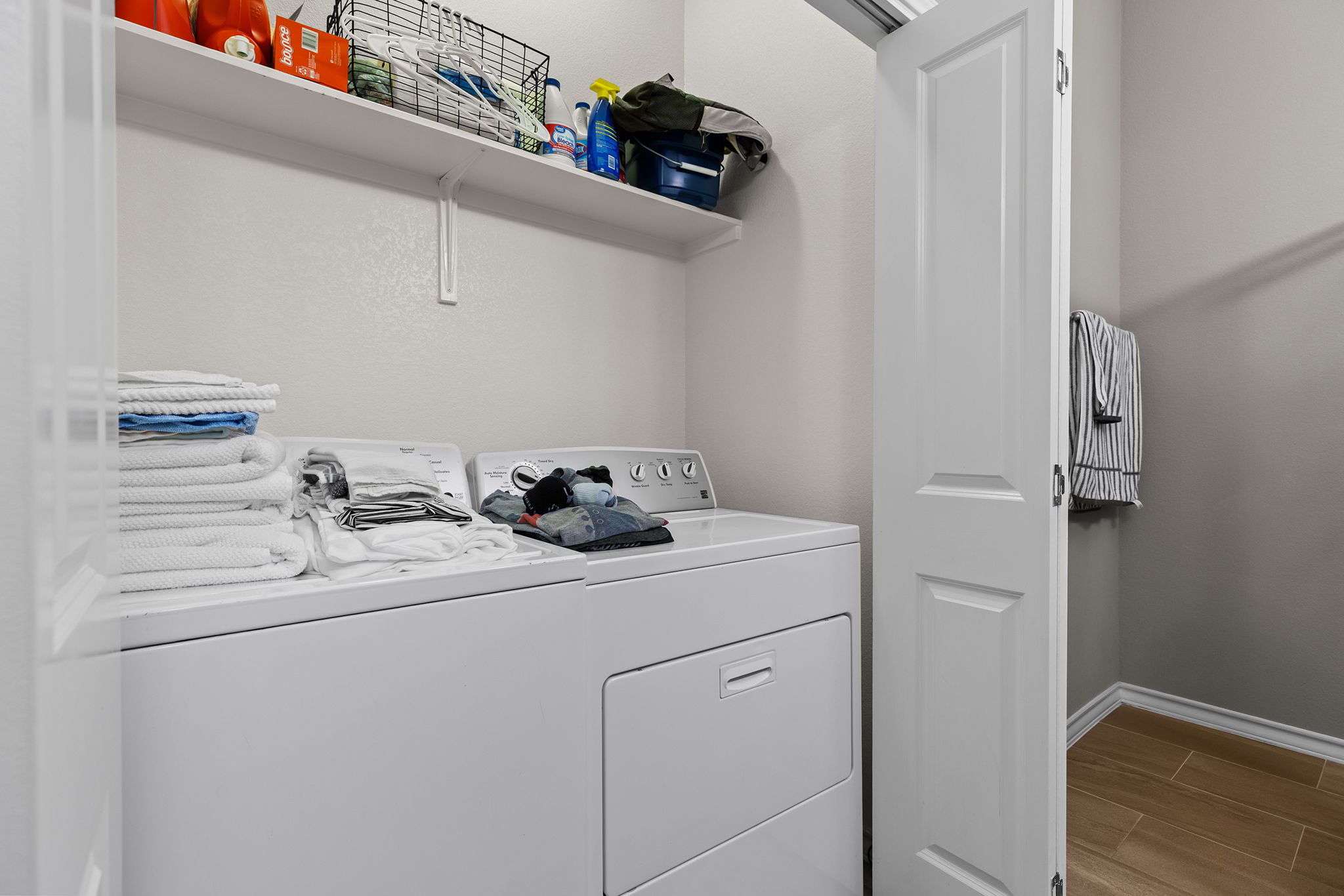 1125 Highknoll Lane Georgetown, TX 78628 - Photo 33 of 40 Laundry area featuring wood finish floors and washer and clothes dryer