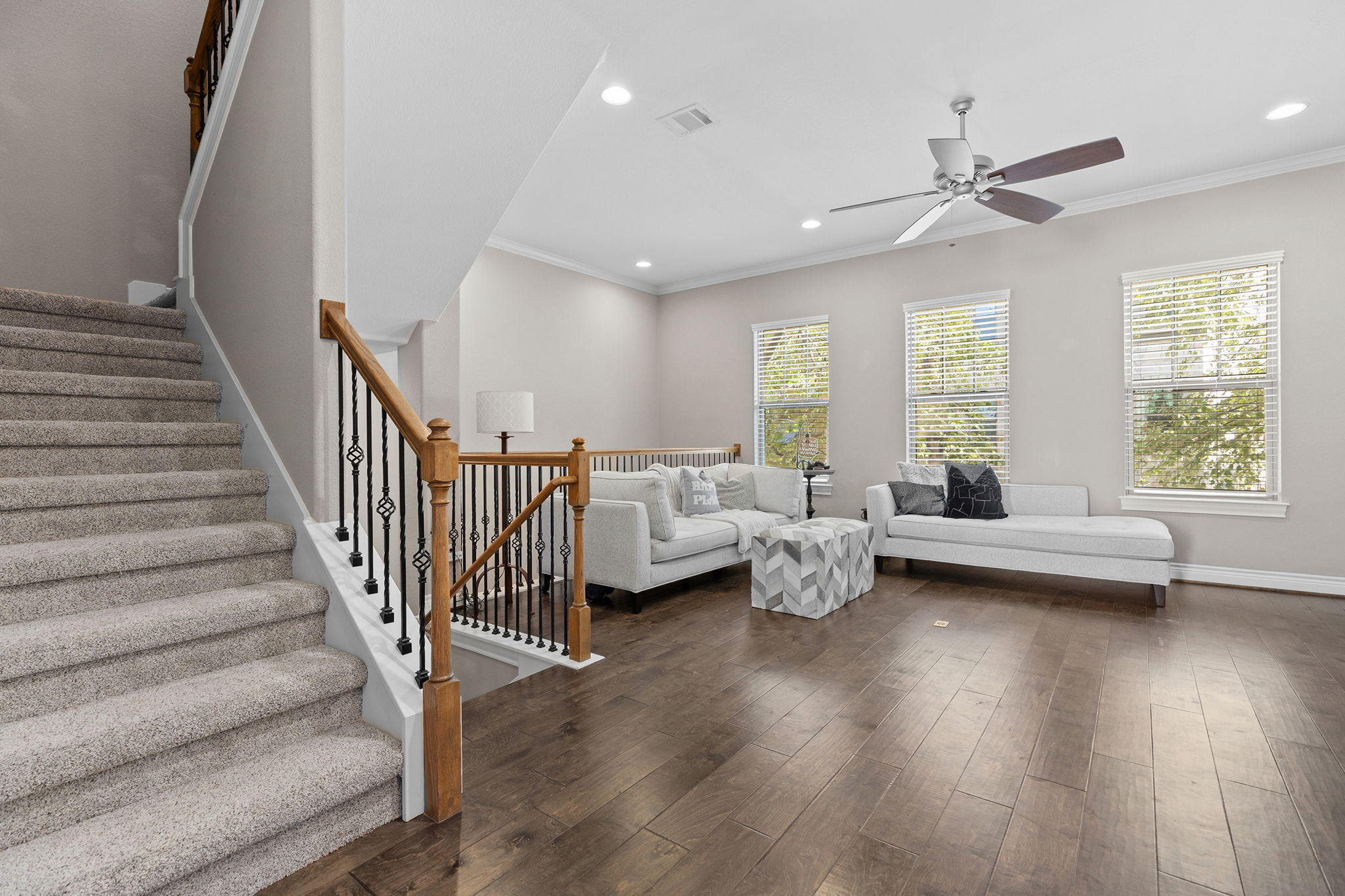 1125 Highknoll Lane Georgetown, TX 78628 - Photo 6 of 40 Living area with dark wood-style flooring, crown molding, recessed lighting, and a ceiling fan
