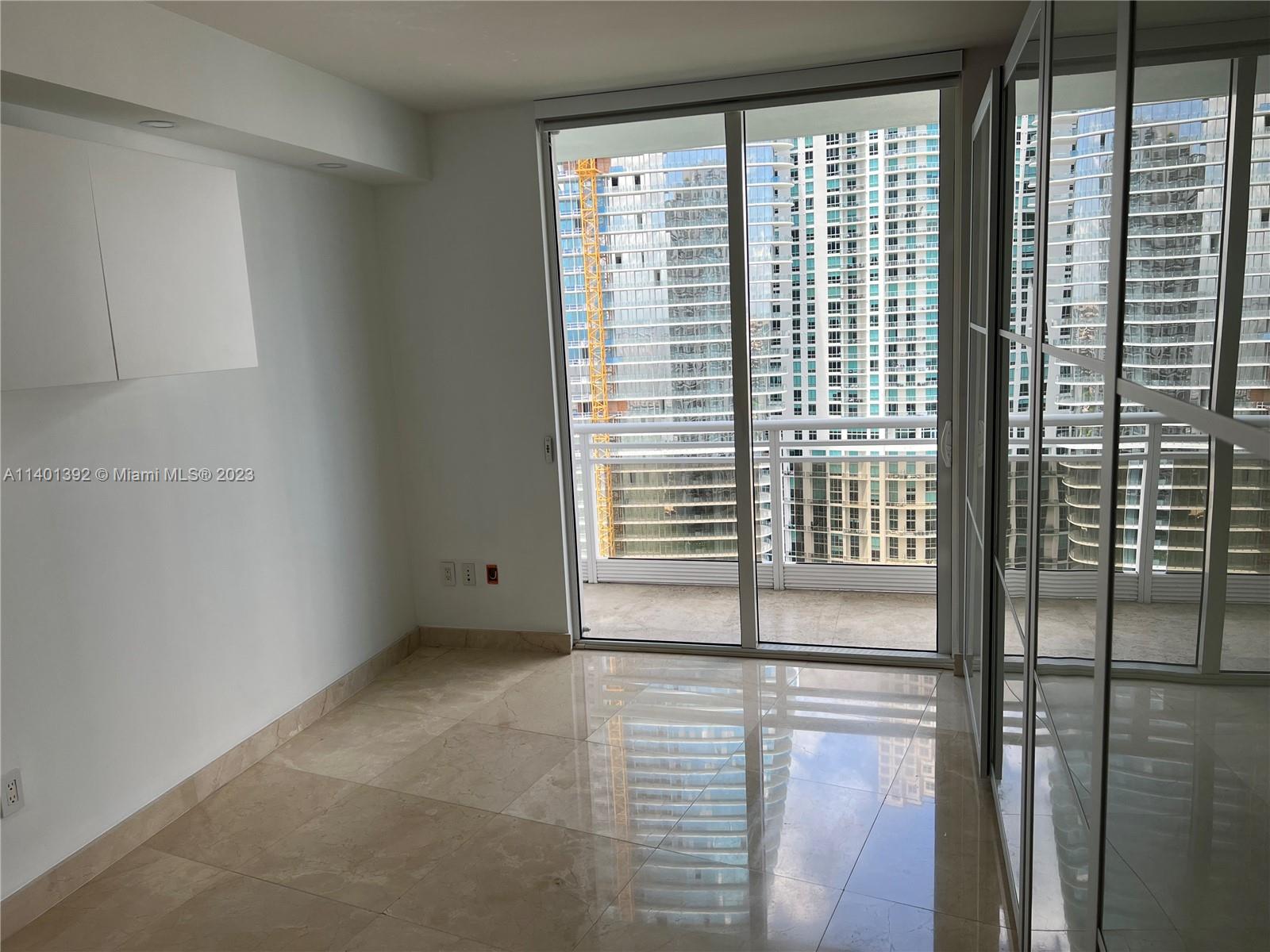 901 Brickell Key Boulevard, Unit 2506 Miami, FL 33131 - Photo 11 of 24 a view of a bathroom with a window