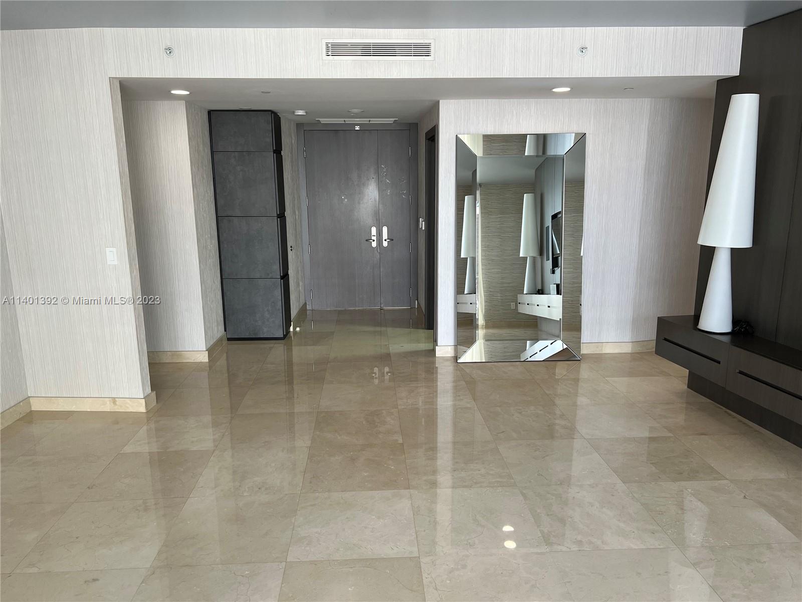 901 Brickell Key Boulevard, Unit 2506 Miami, FL 33131 - Photo 8 of 24 a view of a room with a furniture