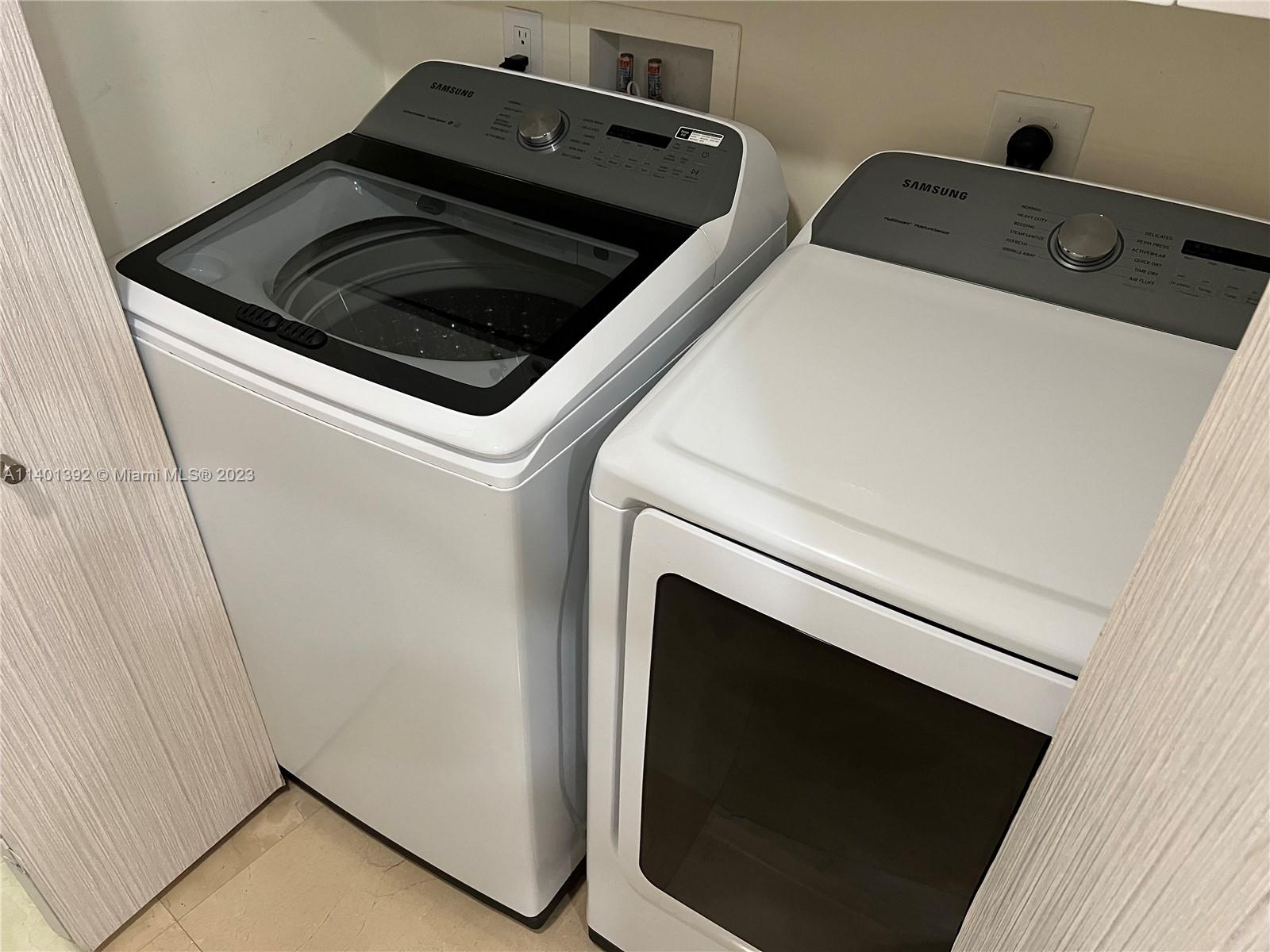 901 Brickell Key Boulevard, Unit 2506 Miami, FL 33131 - Photo 9 of 24 a close up view of washer and dryer