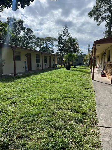 a view of a backyard of the house