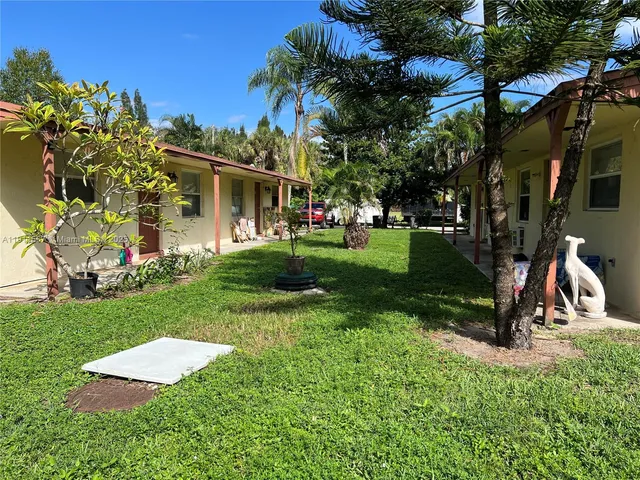 a view of a backyard with a garden and plants