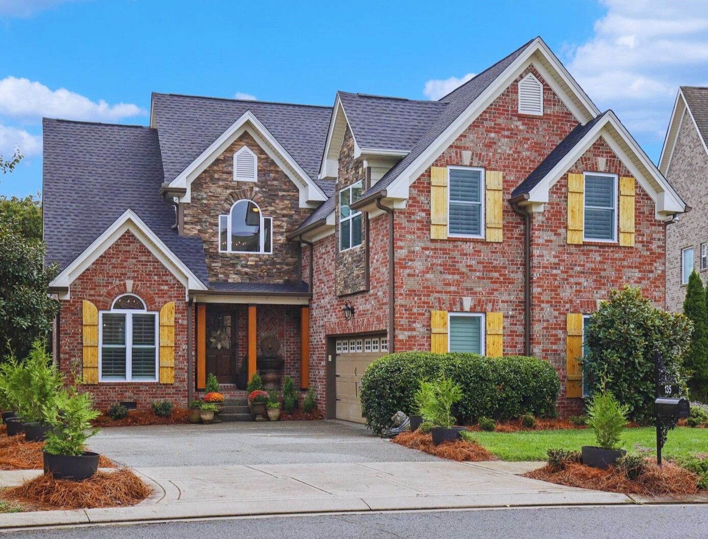 a front view of a house with a yard