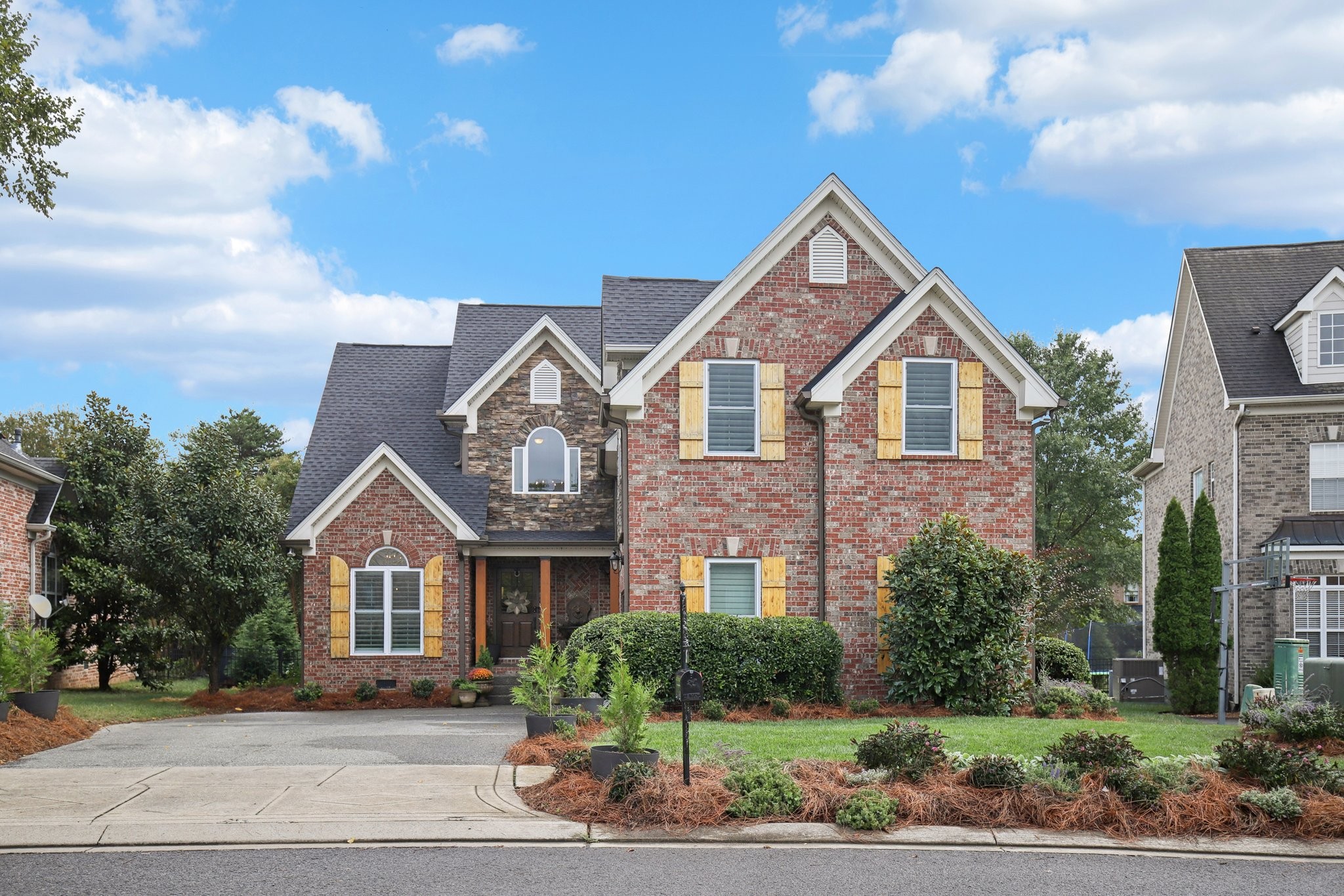 135 Ruland Circle Hendersonville, TN 37075 - Photo 2 of 89 a front view of a house with a yard and garage