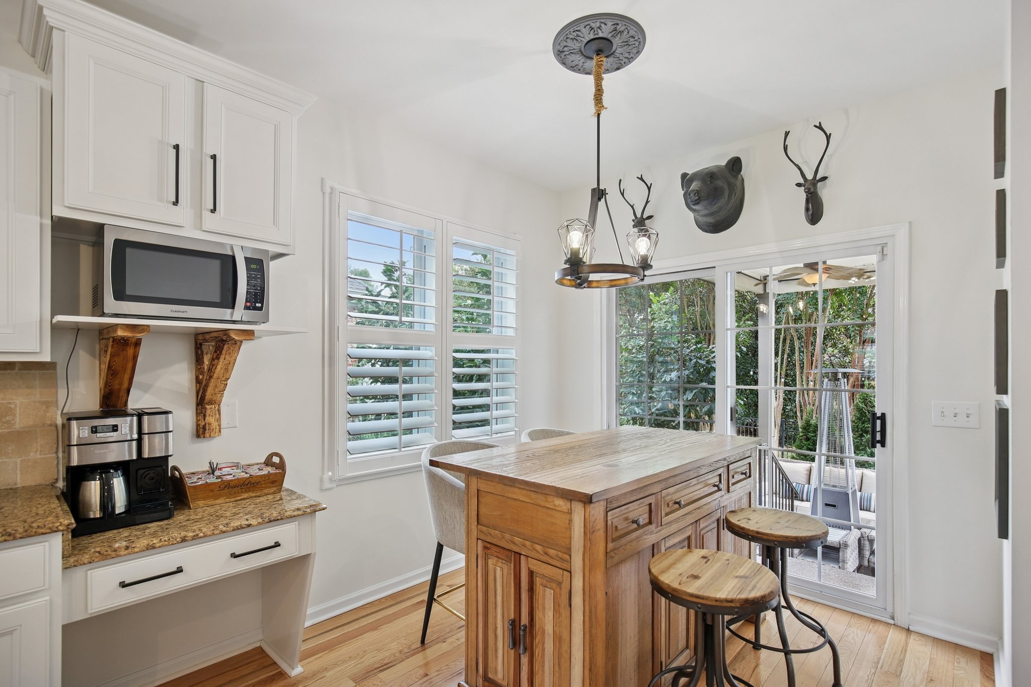 135 Ruland Circle Hendersonville, TN 37075 - Photo 24 of 89 a kitchen with stainless steel appliances kitchen island granite countertop a table chairs in it and wooden floors