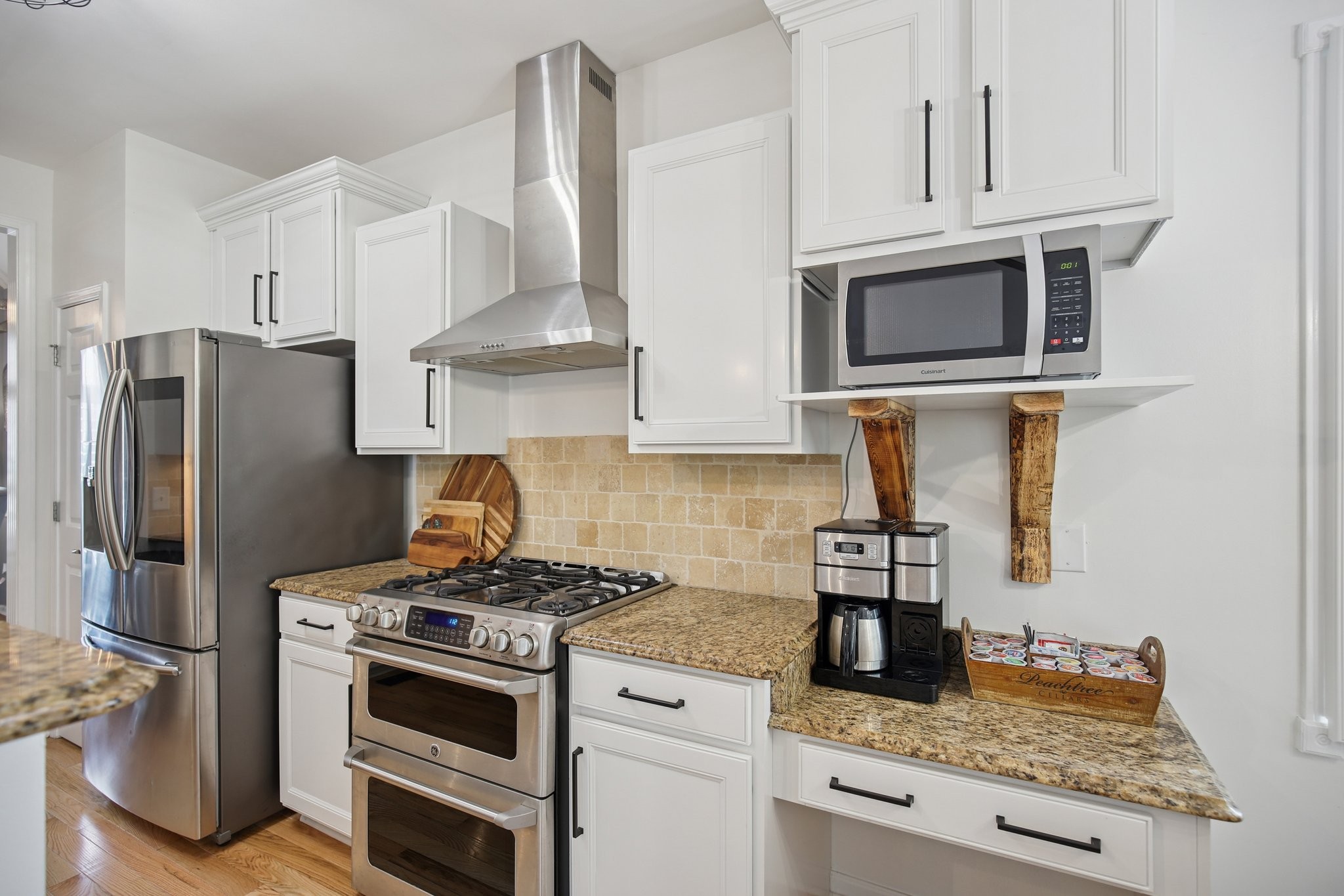 135 Ruland Circle Hendersonville, TN 37075 - Photo 33 of 89 a kitchen with stainless steel appliances granite countertop a stove a refrigerator and a microwave
