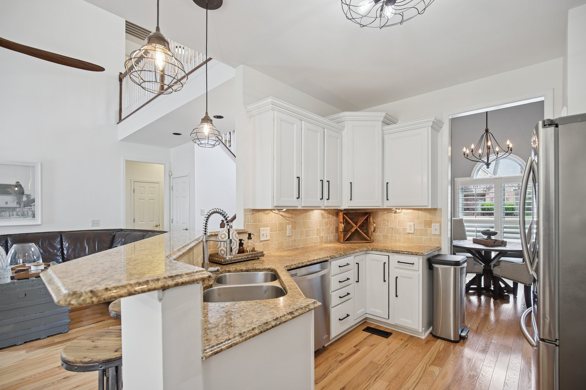 135 Ruland Circle Hendersonville, TN 37075 - Photo 35 of 89 a kitchen with granite countertop a sink cabinets and wooden floor
