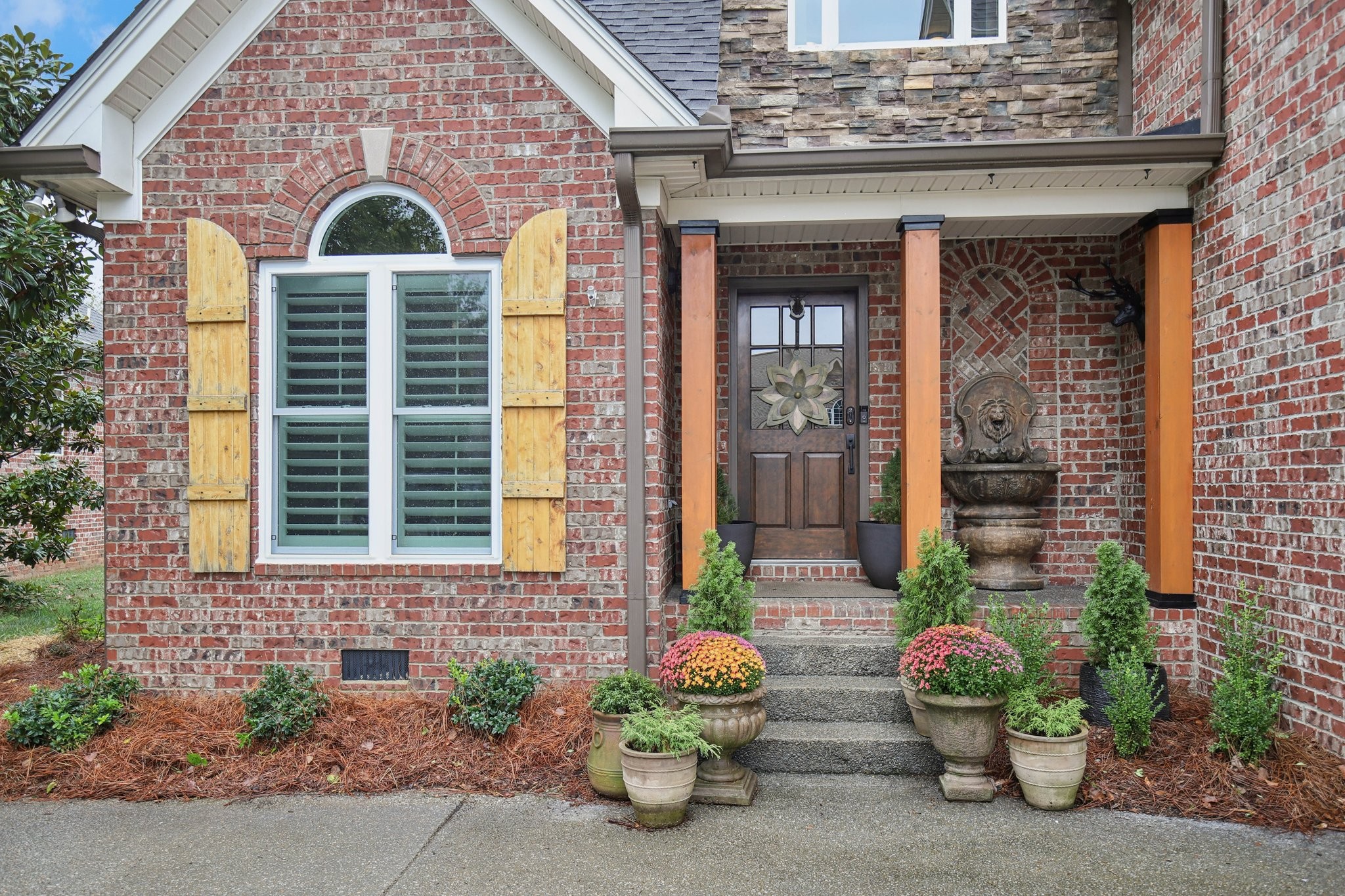 135 Ruland Circle Hendersonville, TN 37075 - Photo 6 of 89 a front view of a brick house with a yard
