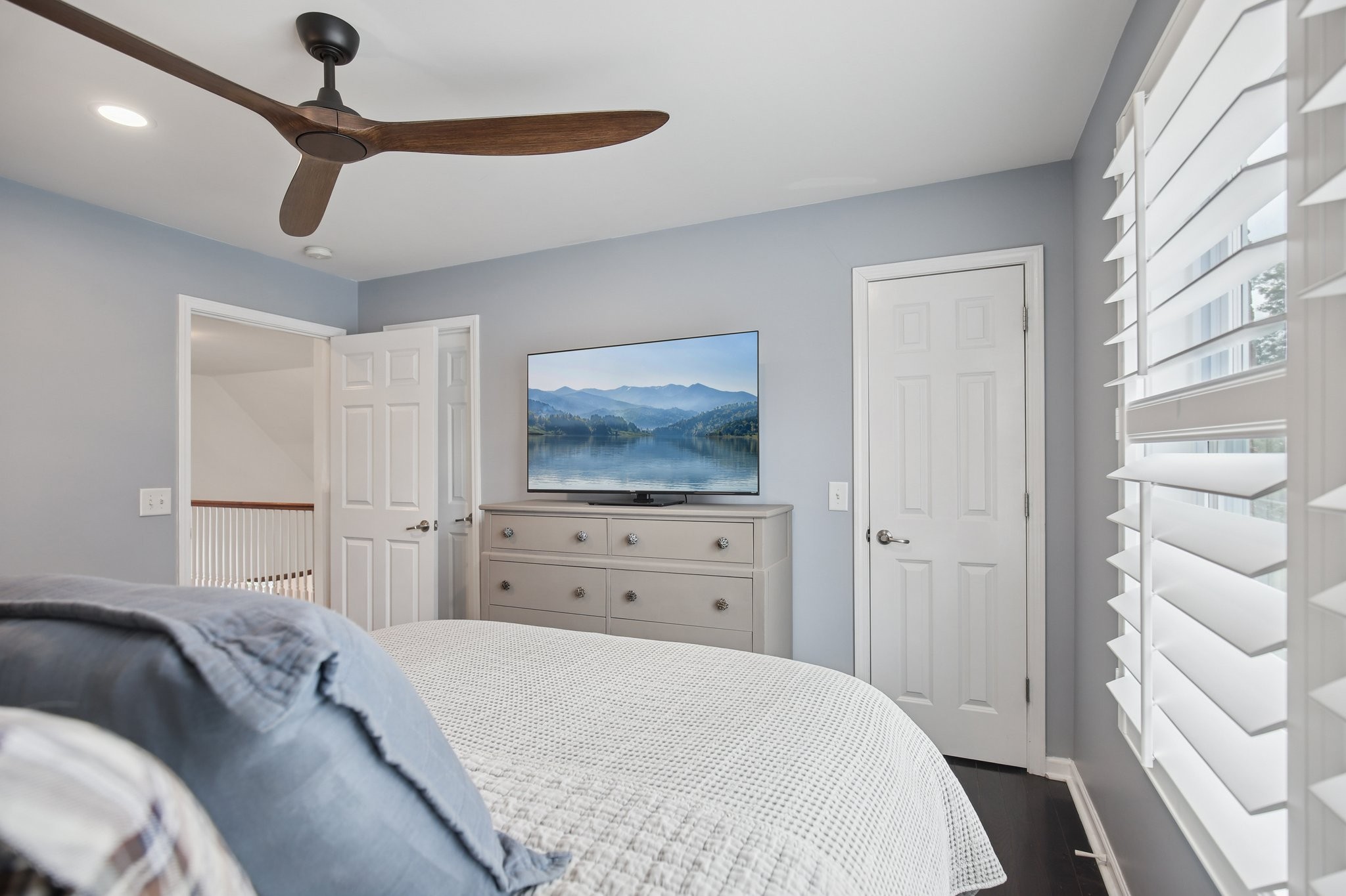 135 Ruland Circle Hendersonville, TN 37075 - Photo 63 of 89 a bedroom with a bed and a chandelier