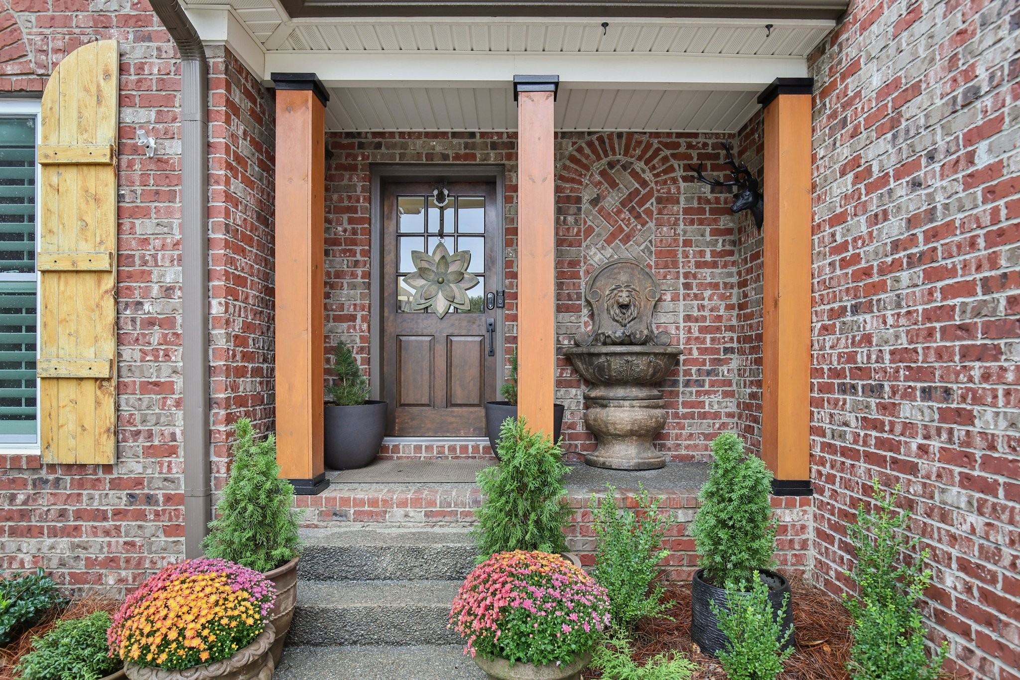 135 Ruland Circle Hendersonville, TN 37075 - Photo 7 of 89 a front view of a house with a glass door