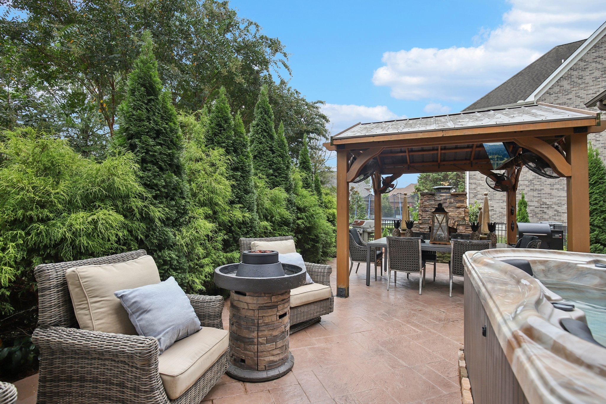 135 Ruland Circle Hendersonville, TN 37075 - Photo 78 of 89 a view of a patio with couches chairs and a table and chairs