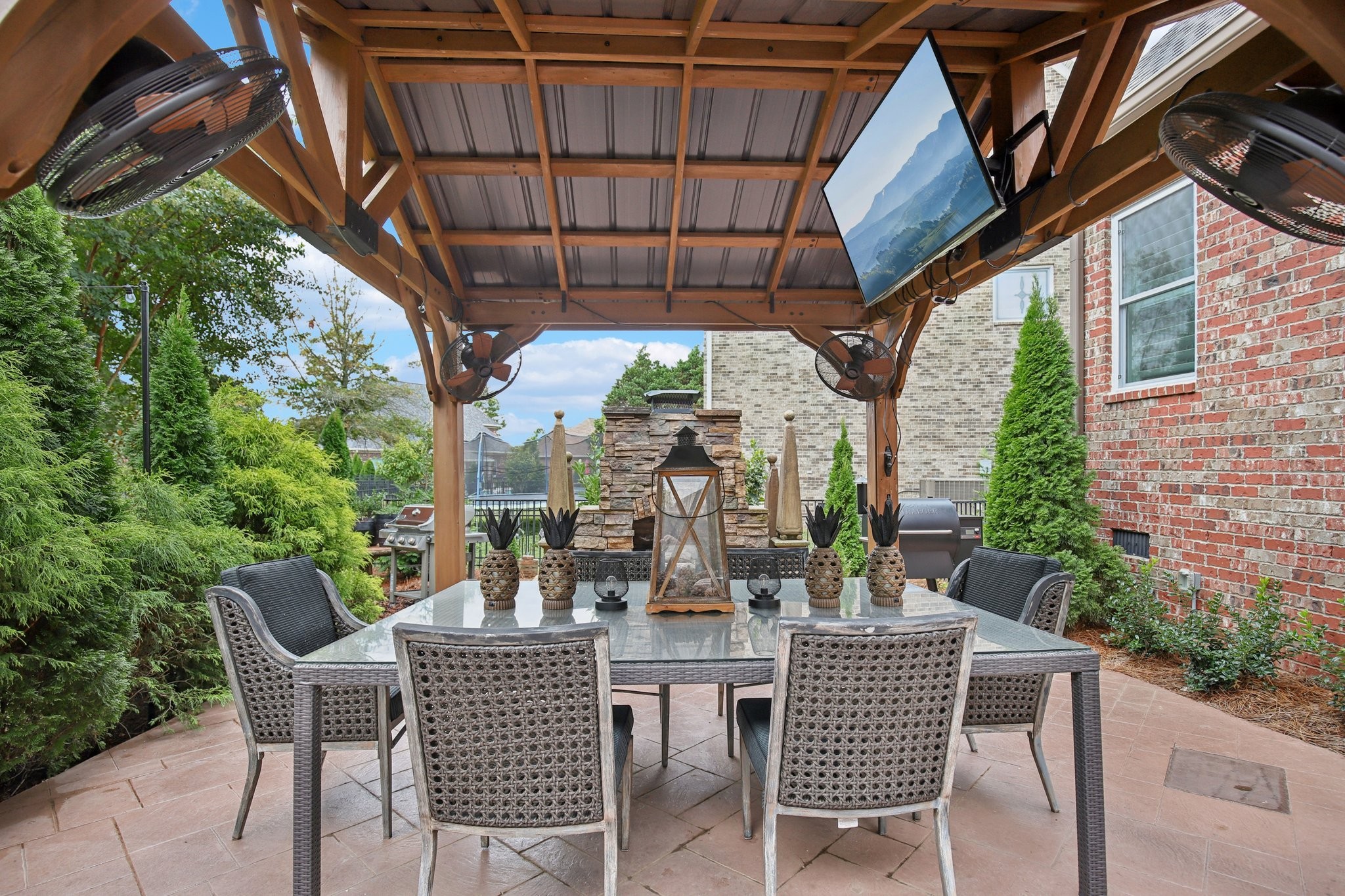 135 Ruland Circle Hendersonville, TN 37075 - Photo 80 of 89 a view of a patio with a table chairs and a potted plant
