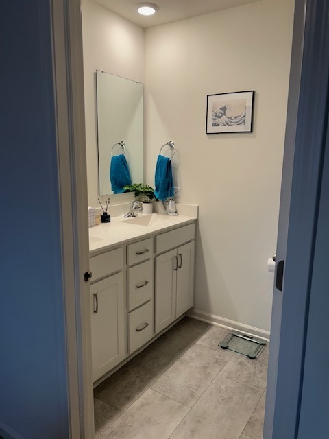 314 Summit Circle Lombard, IL 60148 - Photo 12 of 24 a spacious bathroom with a double vanity sink and a mirror