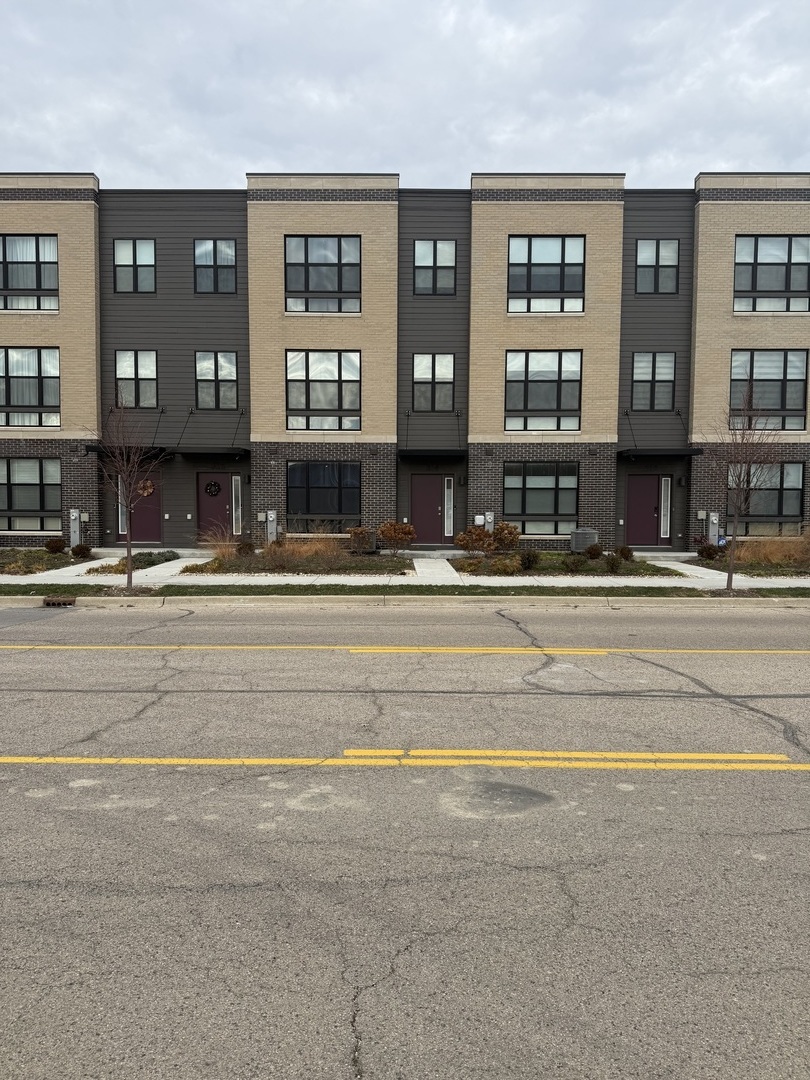 314 Summit Circle Lombard, IL 60148 - Photo 19 of 24 a view of a building and a pathway both side of a street