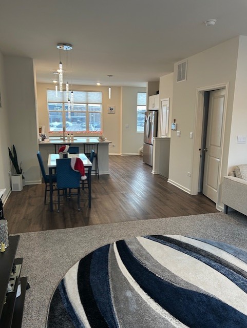 314 Summit Circle Lombard, IL 60148 - Photo 5 of 24 a living room with dining room and wooden floor
