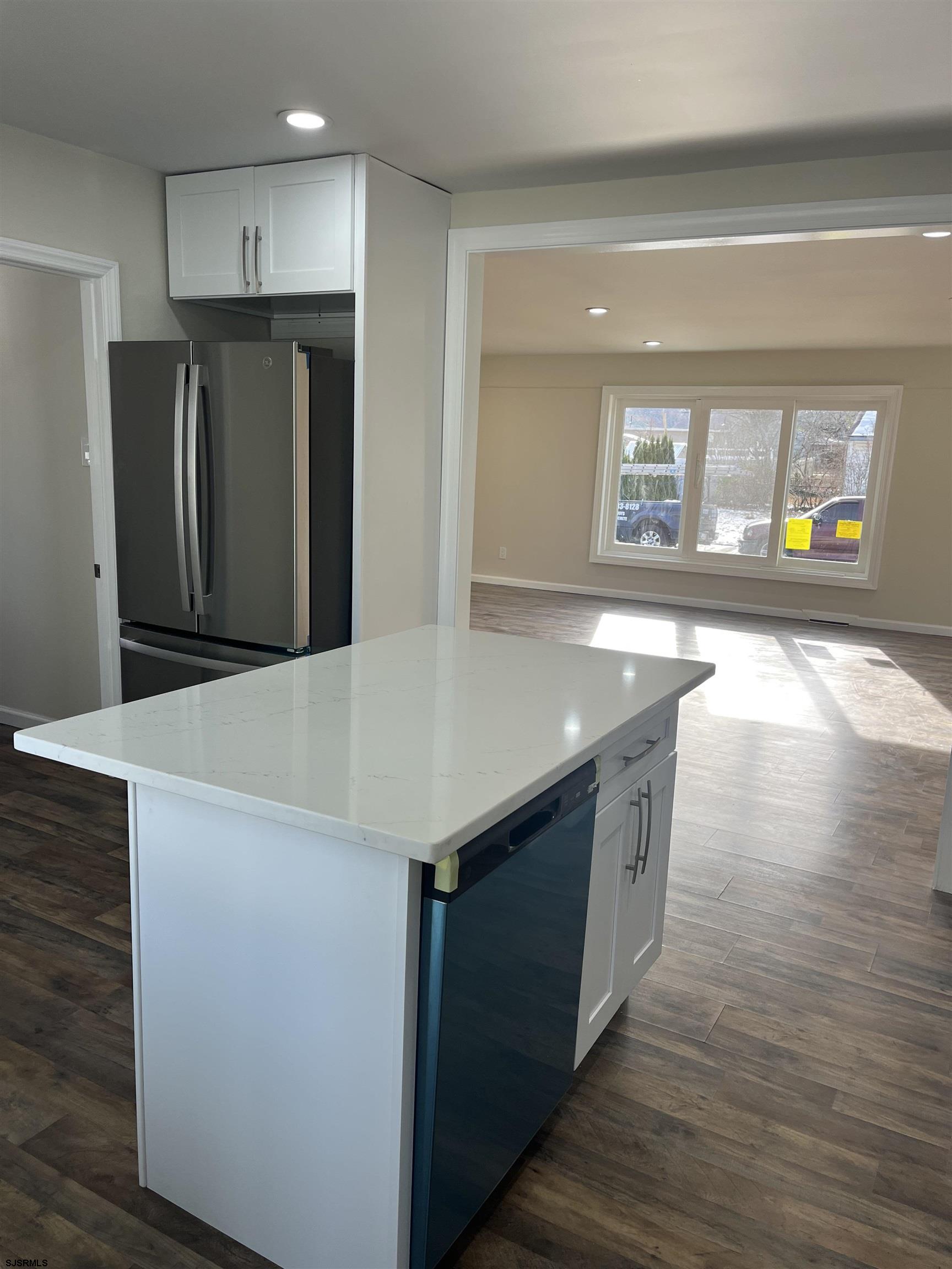 19 Merion Drive Somers Point, NJ 08244 - Photo 2 of 17 a kitchen with stainless steel appliances granite countertop a refrigerator a sink and a stove