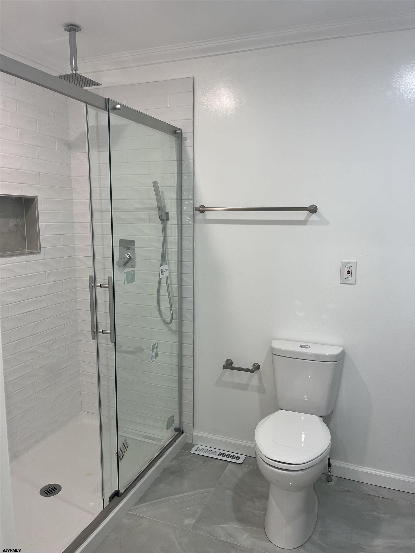 19 Merion Drive Somers Point, NJ 08244 - Photo 6 of 17 a bathroom with a toilet and a shower