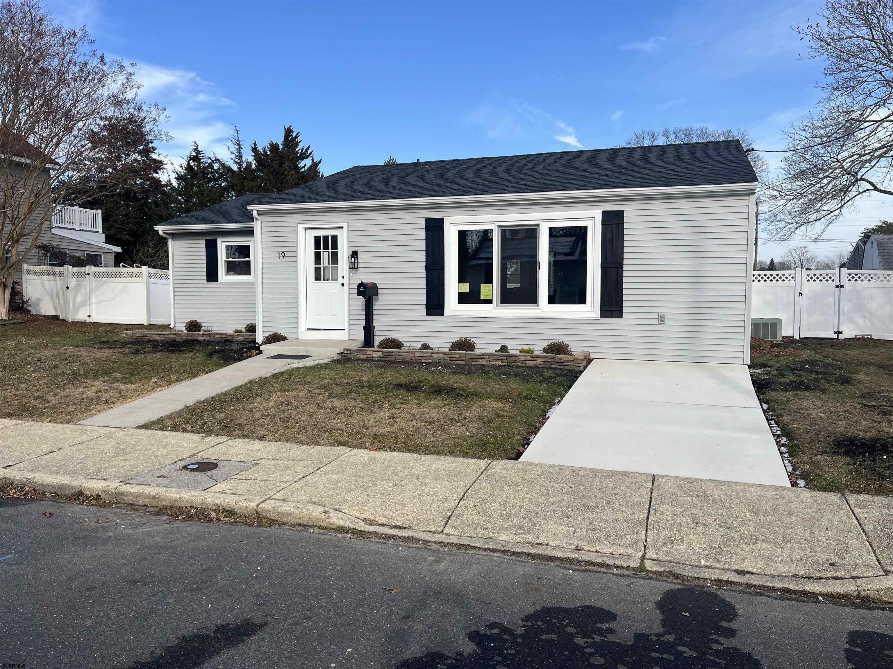 19 Merion Drive Somers Point, NJ 08244 - Photo 9 of 17 a front view of a house with a yard