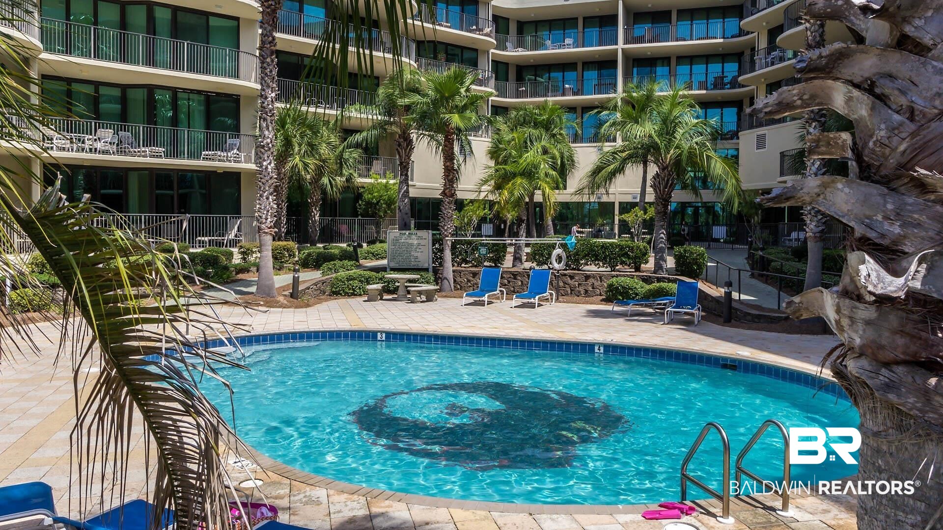 27580 Canal Road, Unit 1431 Orange Beach, AL 36561 - Photo 56 of 73 Community pool with a patio