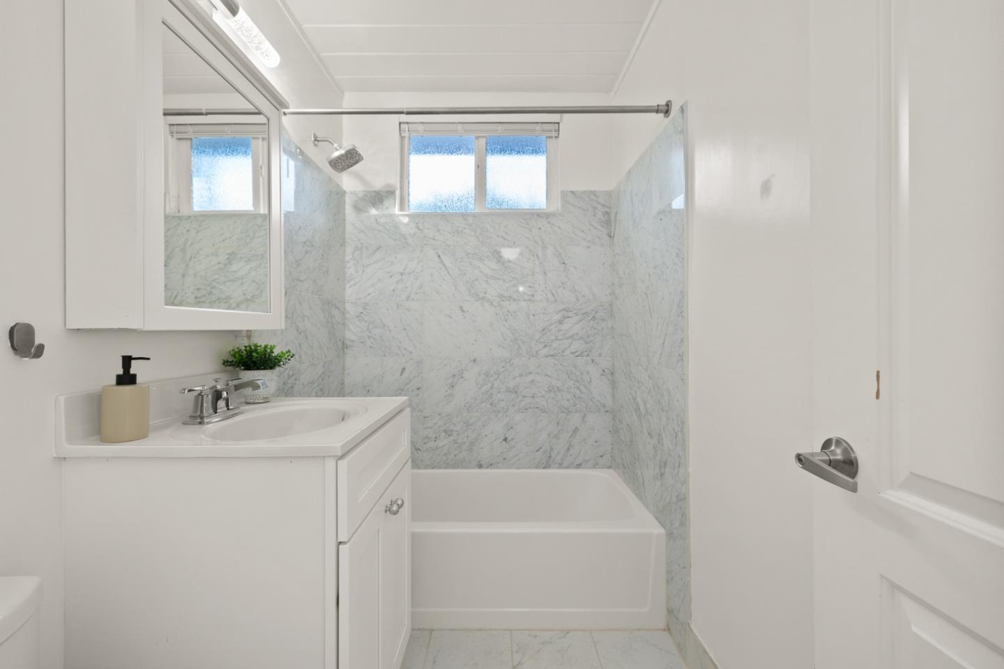 2443 Thaddeus Drive Mountain View, CA 94043 - Photo 13 of 38 a bathroom with a sink a mirror and a bathtub