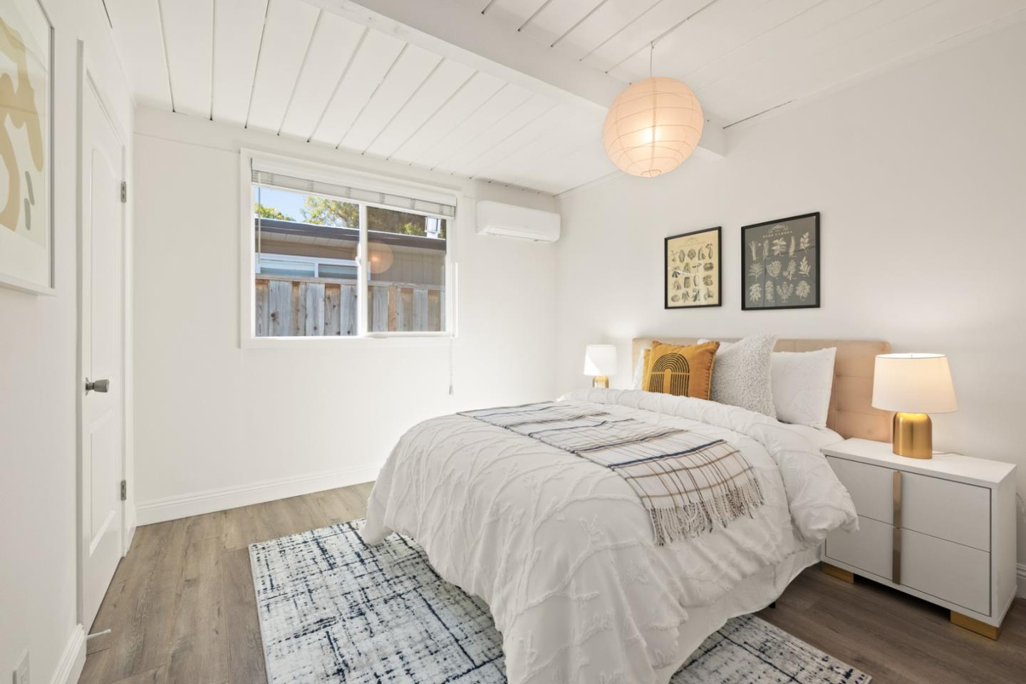 2443 Thaddeus Drive Mountain View, CA 94043 - Photo 15 of 38 a bedroom with a bed and a painting on the wall