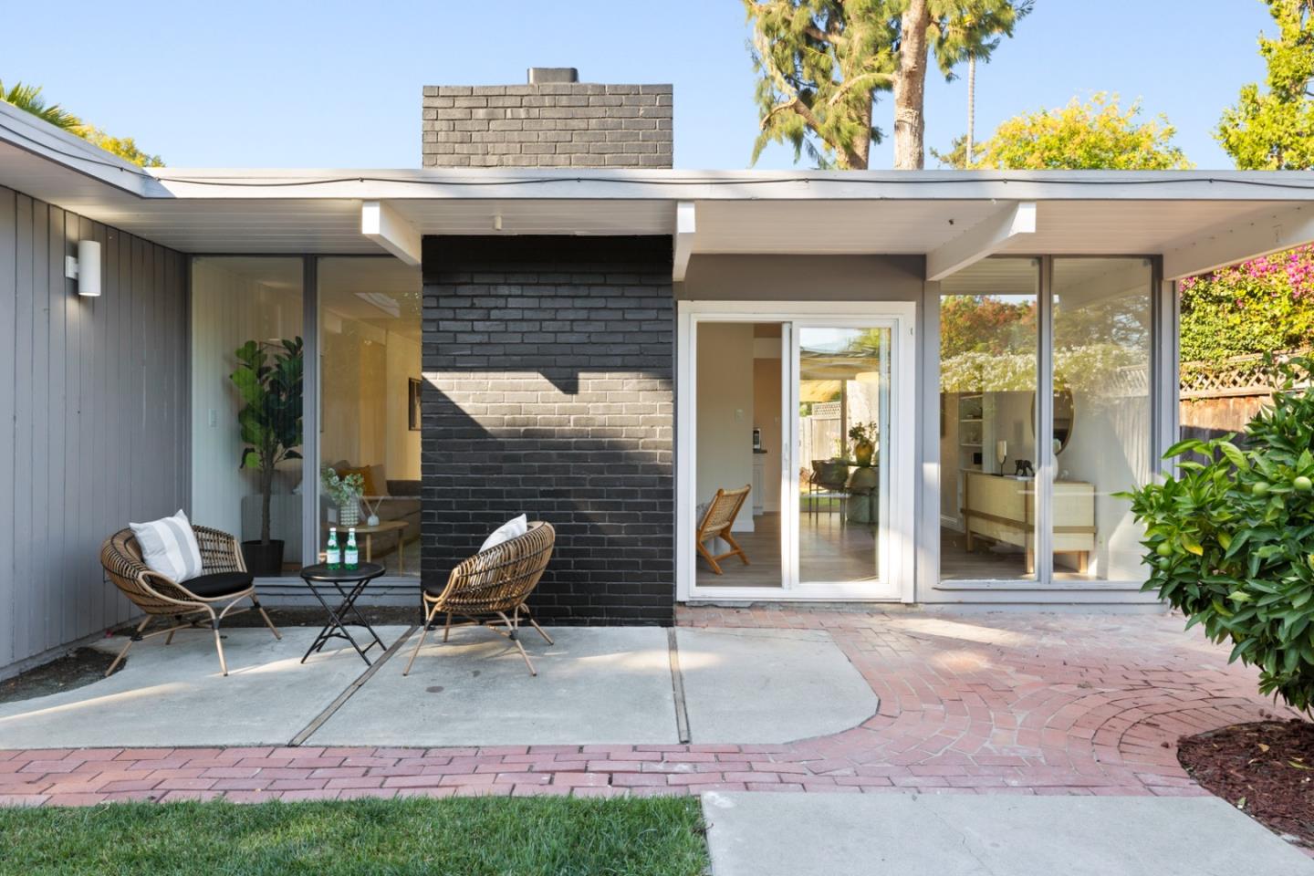 2443 Thaddeus Drive Mountain View, CA 94043 - Photo 18 of 38 a view of a patio with a table and chairs and potted plants