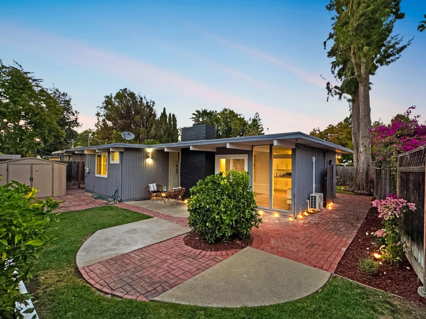 2443 Thaddeus Drive Mountain View, CA 94043 - Photo 29 of 38 a front view of a house with a yard and trees